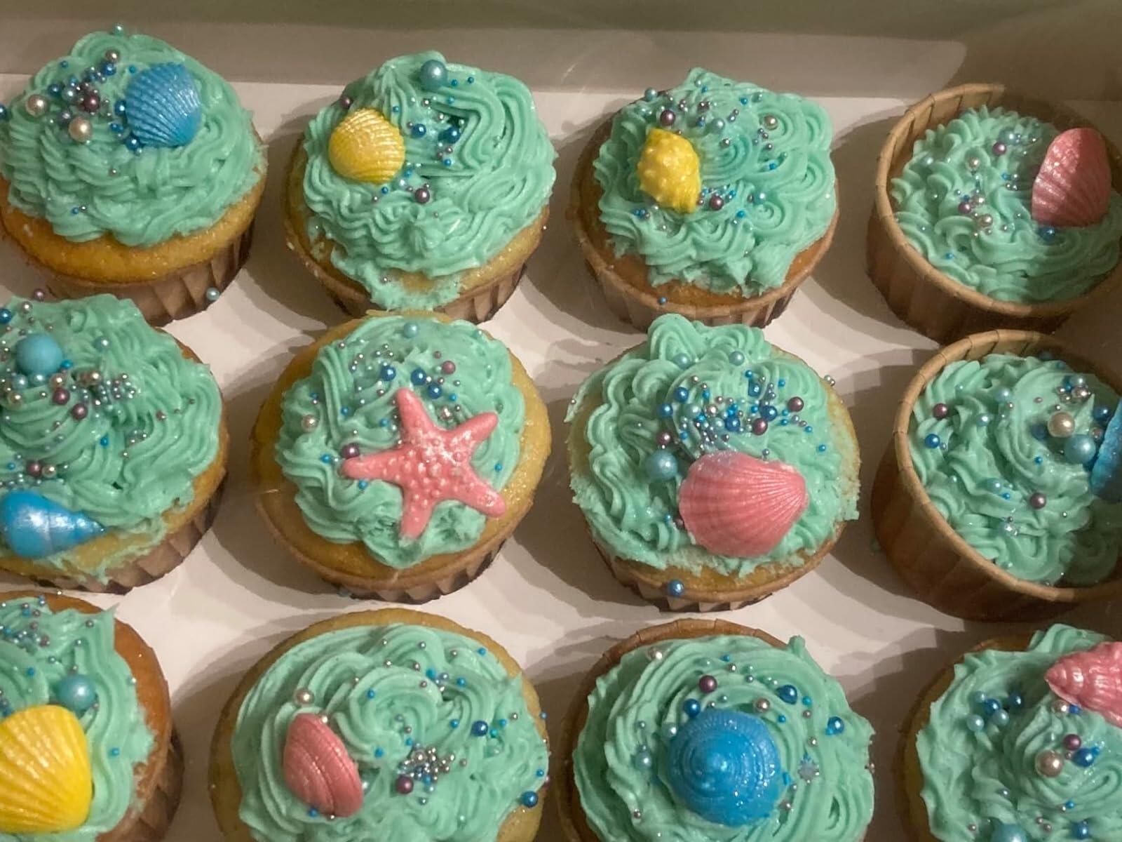 Customers image of coloured sea shells on cupcakes