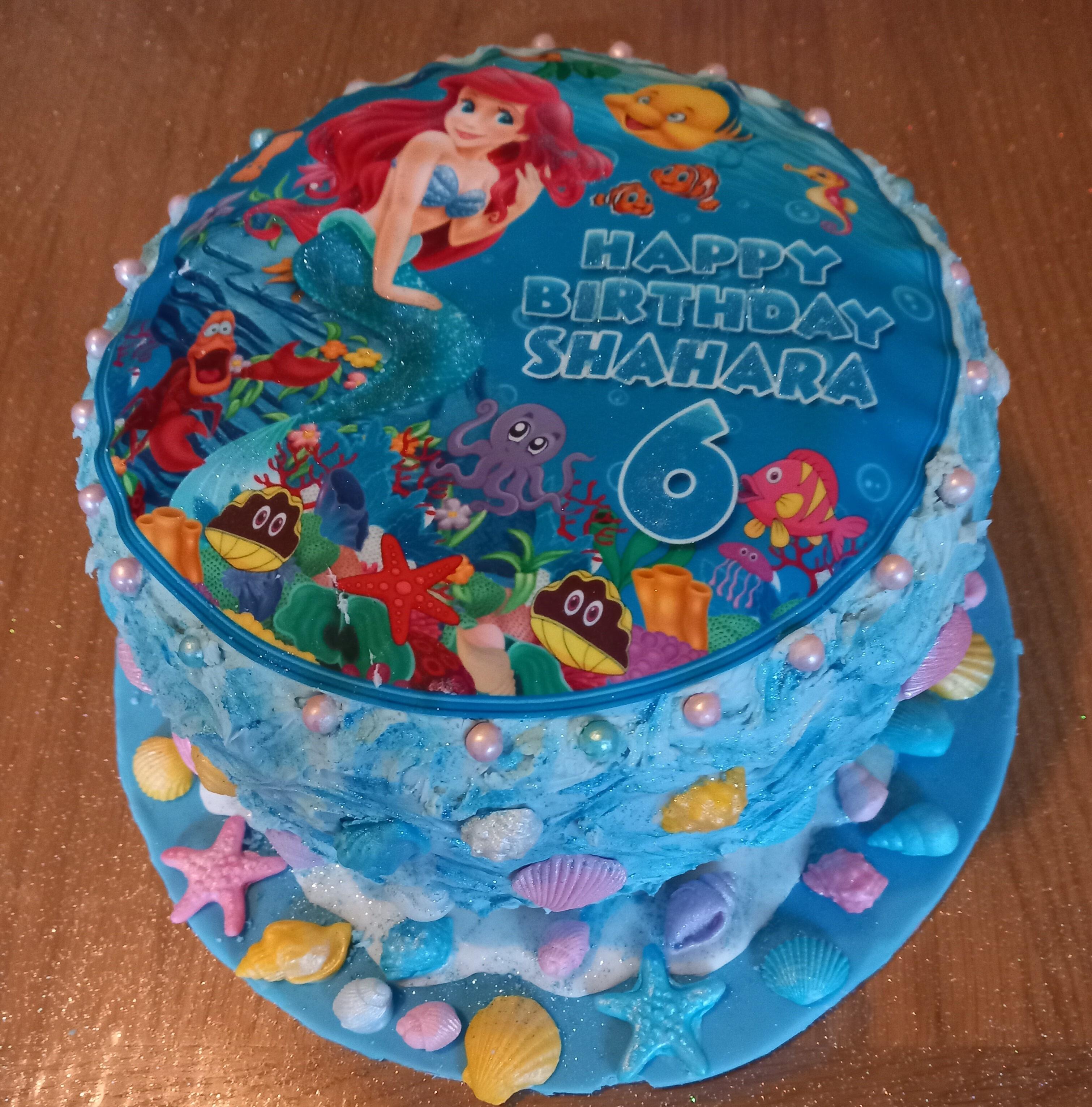 Customers decorated cake using coloured sea shells