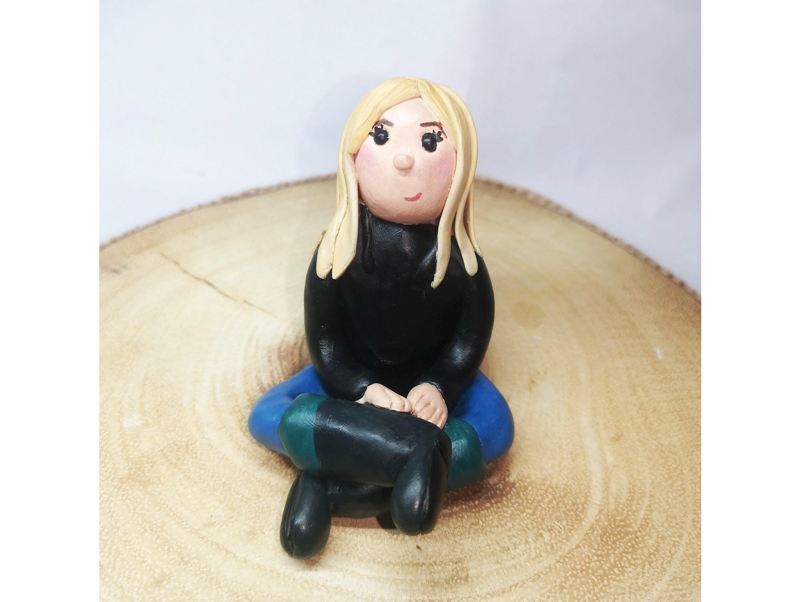 A smiling blonde clay model wearing wellington boots