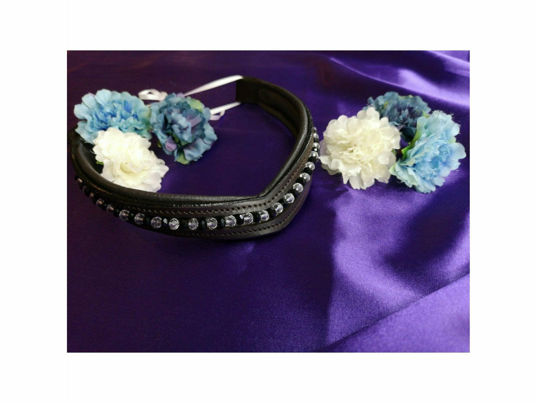 High quality genuine leather browband with hand stitched faceted glass beads sitting on a purple background with artificial flowers