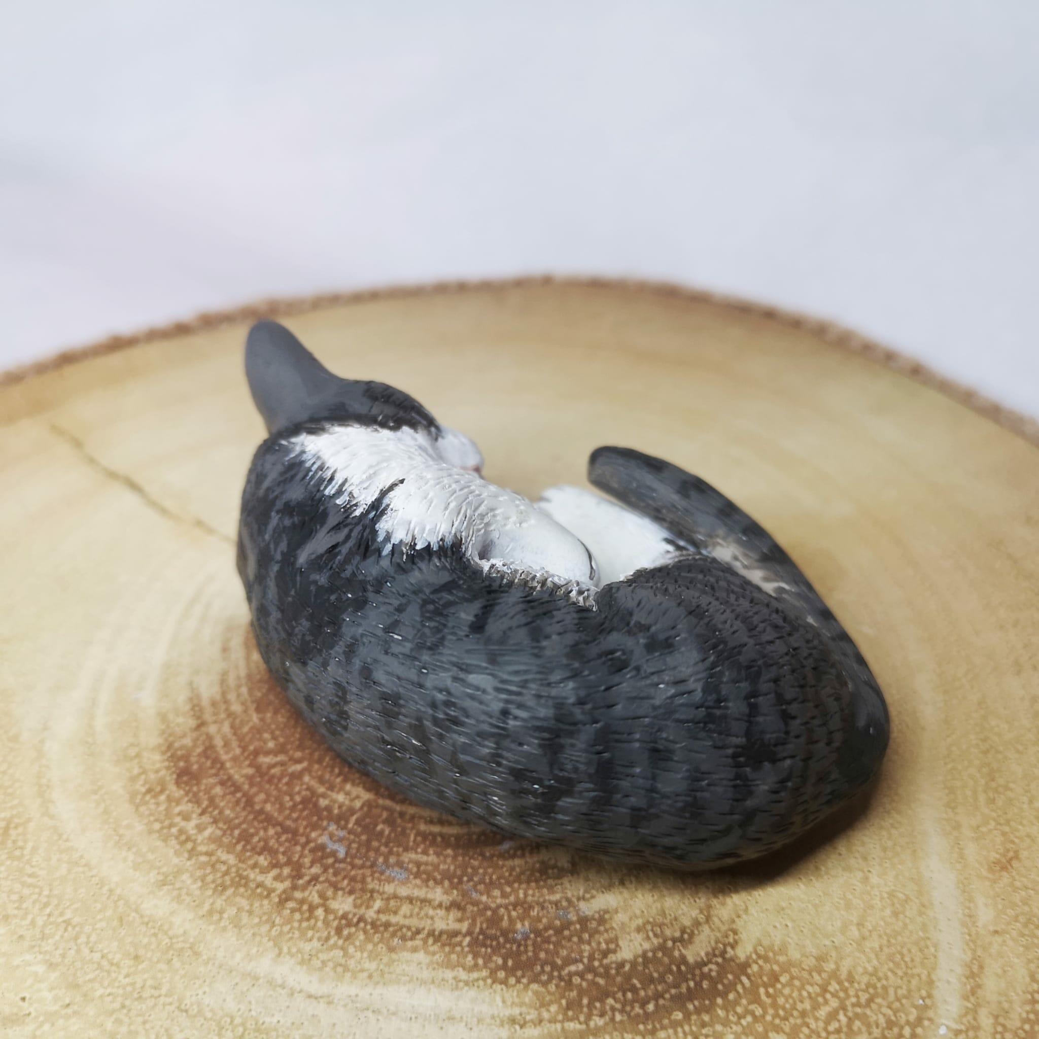 Handmade and handpainted clay model of a cat asleep, showcasing lifelike details and personalized to capture the unique personality of your feline friend.