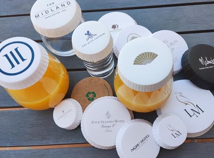 A selection of printed glass covers in a poolside setting for hospitality industry use; hotels, airlines, cruise lines