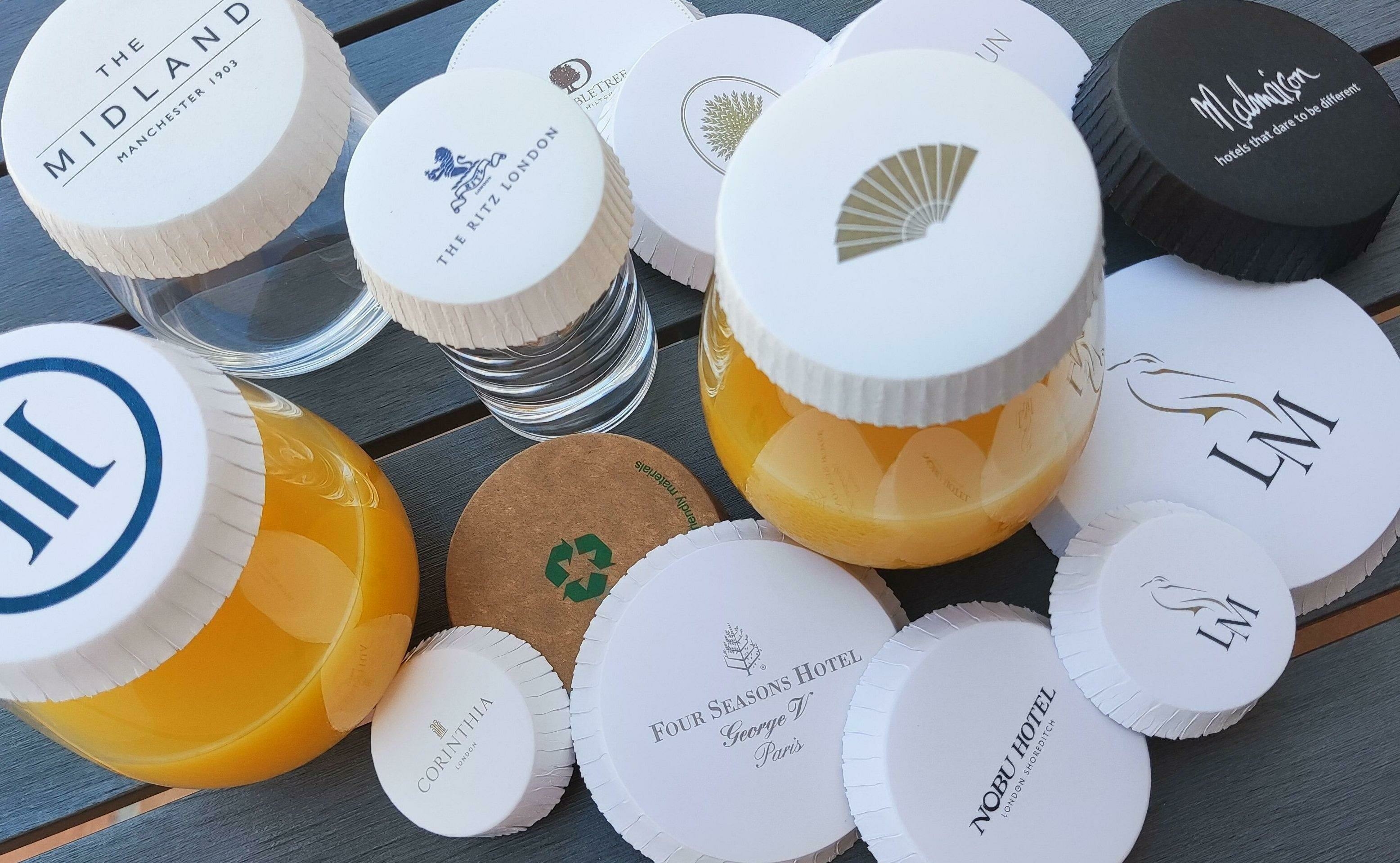 A selection of printed glasscovers including two fitted on a glass