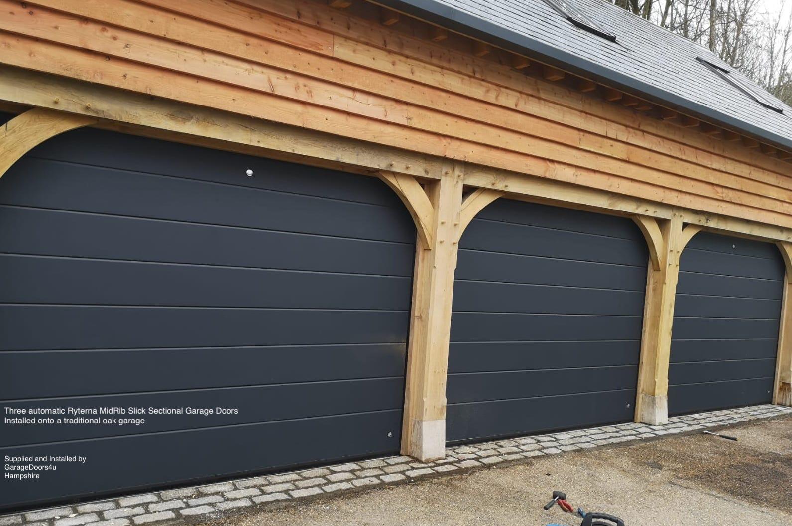 Sectional Garage Doors fitted to an Oak Building