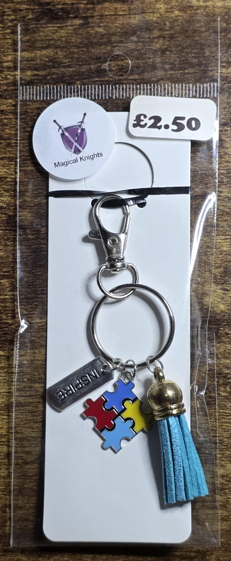 autism inspire charm blue tassel