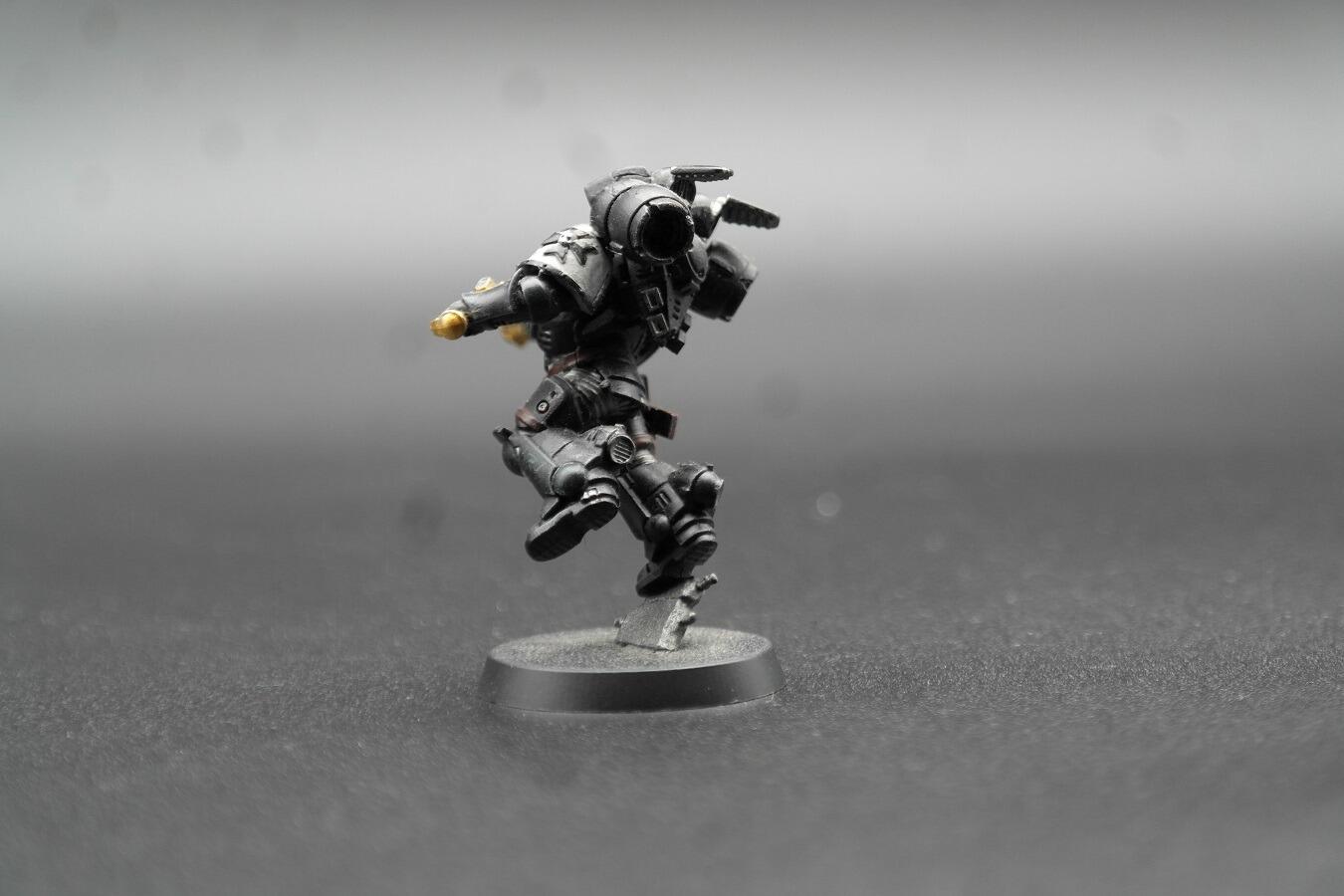 Rear angle shot highlighting backpack vents