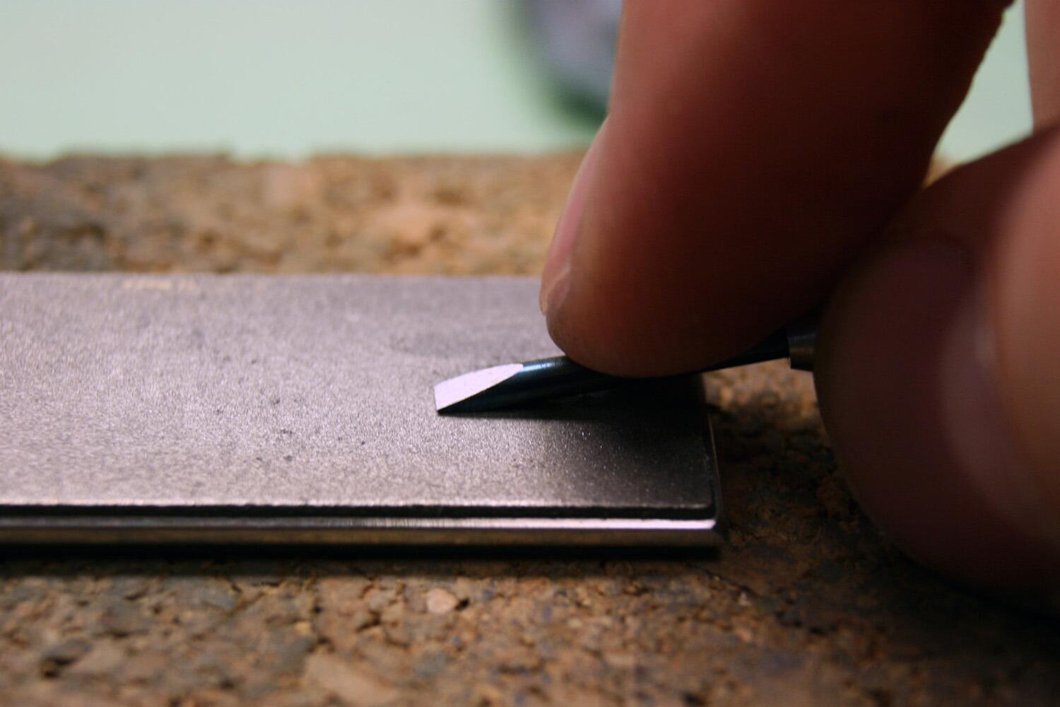 sharpening a screwdriver using a diamond lap
