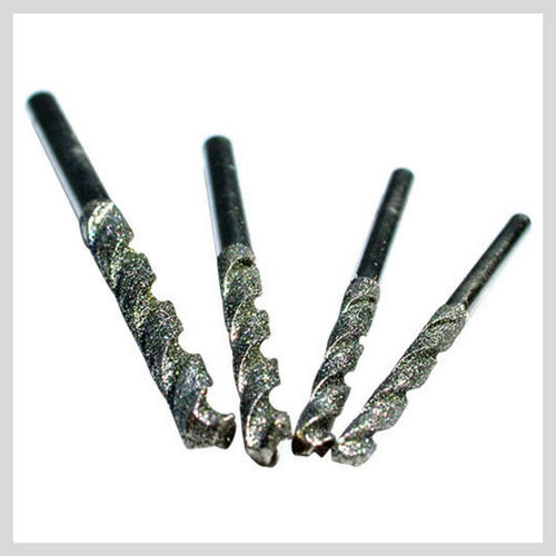 Drill bit outlet diamond ring