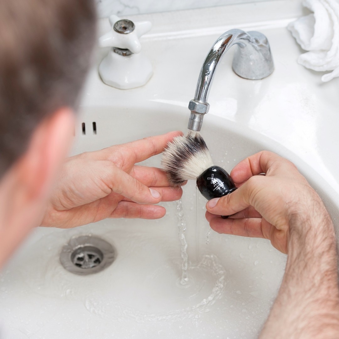 Pictured: Cleaning the shaving brush bundle- an important post-shave step to help maintain your brush.