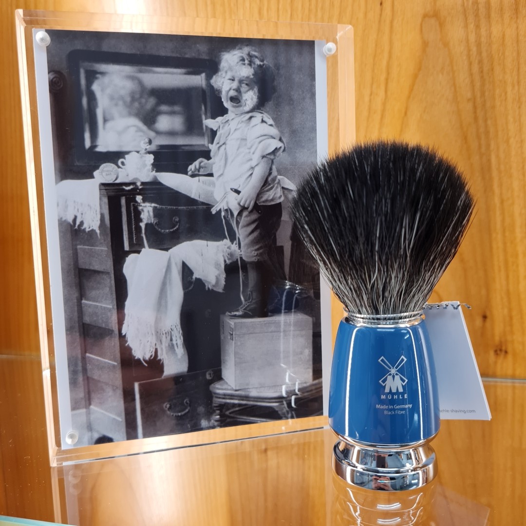 The exhibition features a range of vintage photography and advertisements all exploring the Rite of Passage that is shaving.