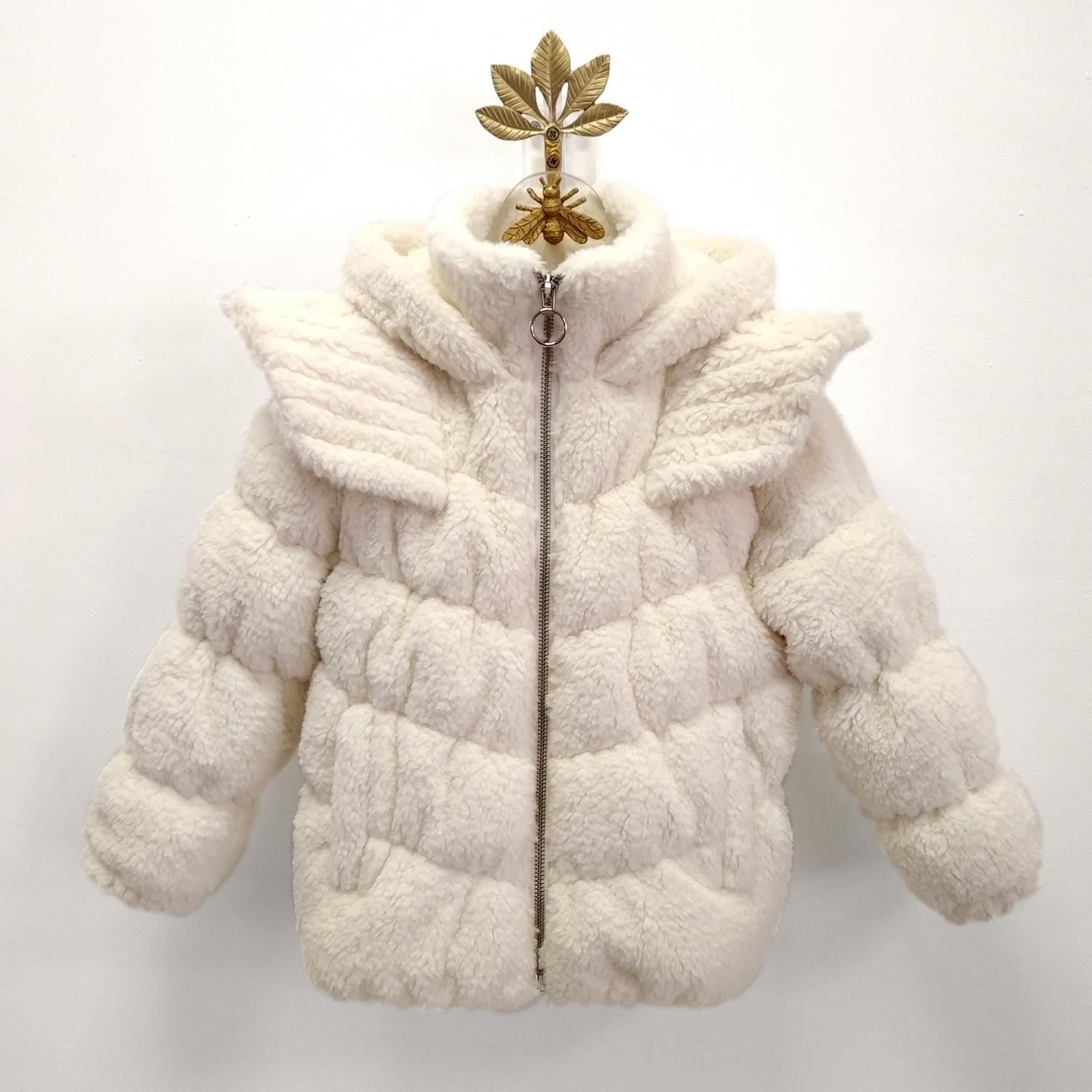 DAISY is a signature unicorn puffer jacket in a cream teddy faux-fur