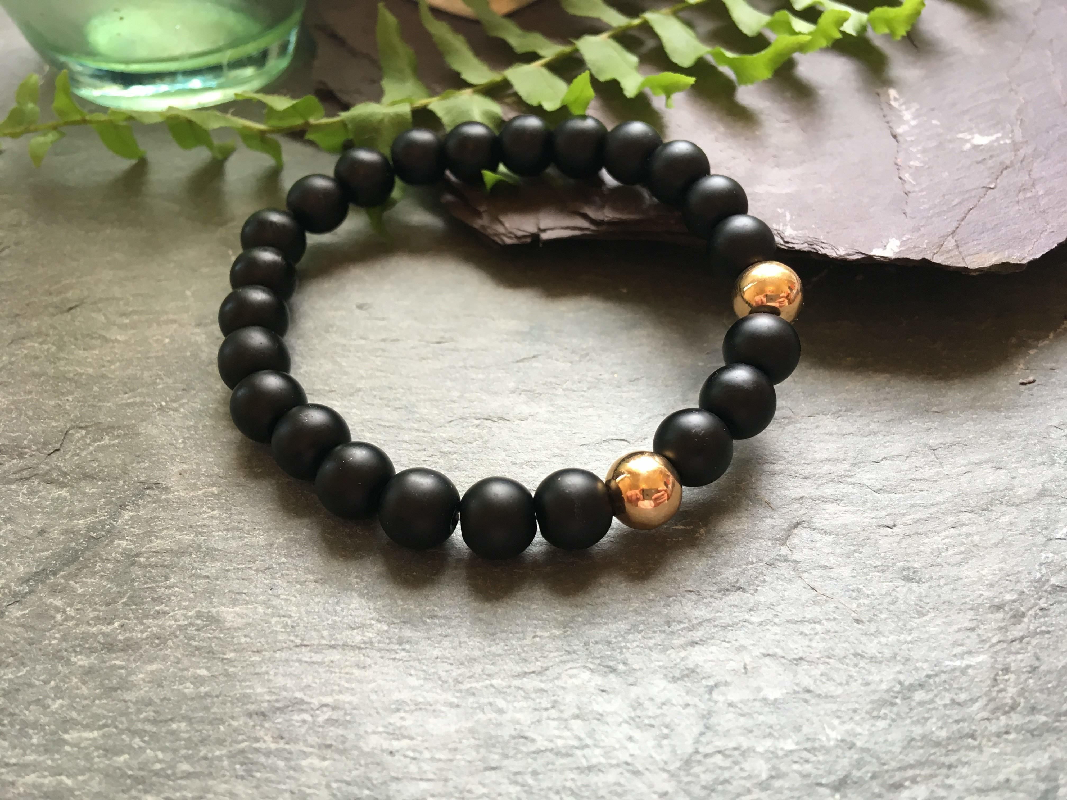 Black And Gold Stylish Bead Bracelet 2 Rose Coloured Metal Beads Black And Gold Stylish Bead Bracelet 2 Rose Coloured Metal Beads Liv