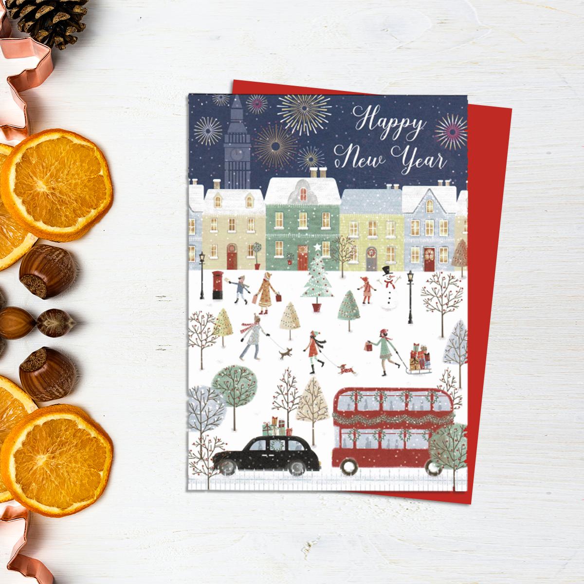 Happy New Year Card Showing A Cityscape With A Red Bus And Black Taxi With People Walking Dogs In The Snow. Full Colour Inside And Out Finishes This Lovely Card