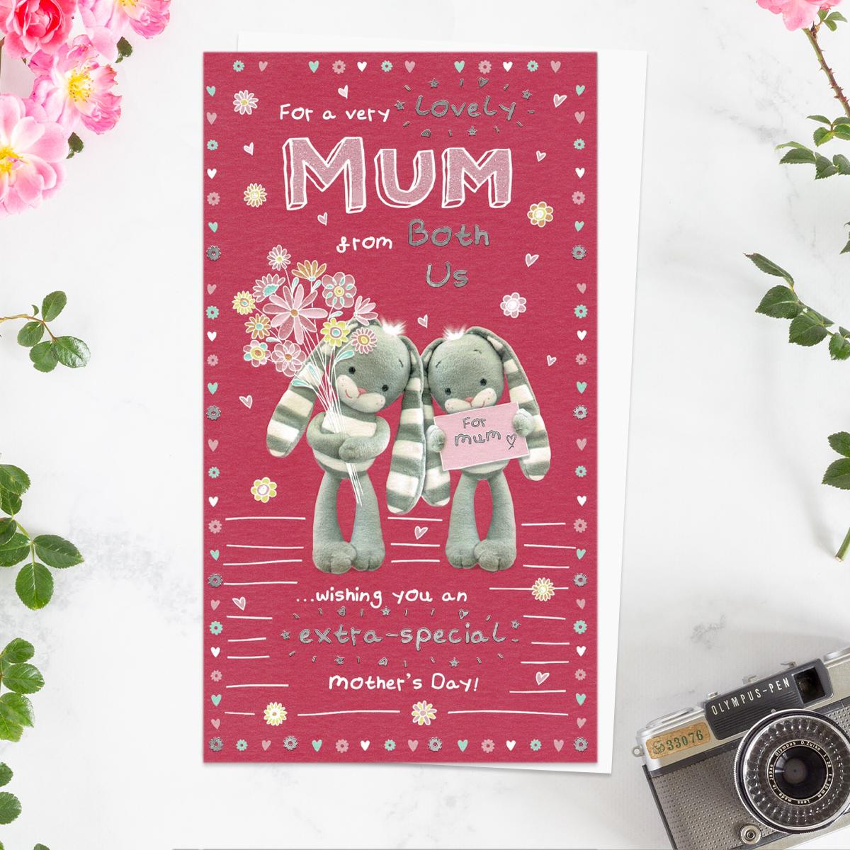 ' For A Very Lovely Mum From Both Of Us' Mother's Day Card. Featuring Hun Bun With Flowers! Complete With Silver foil Detail and White Envelope With Pink Hearts