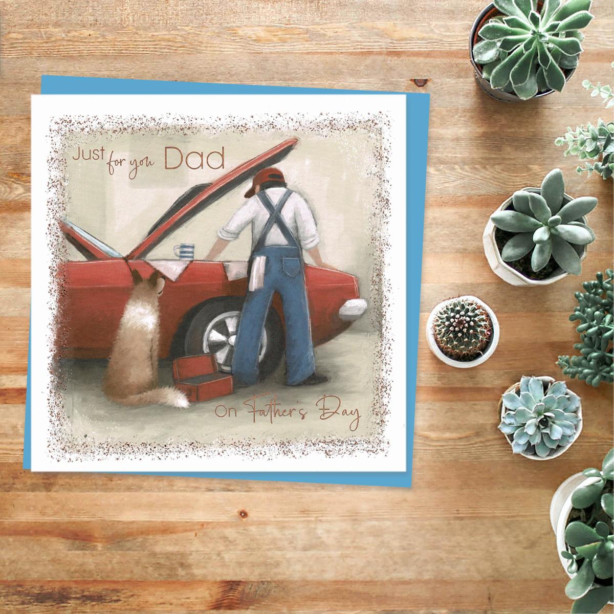 'Just For You Dad' Father's Day Card Featuring A Mechanic Looking Into A Car Bonnet With Dog Nearby! Complete With copper Sparkle And Blue Envelope