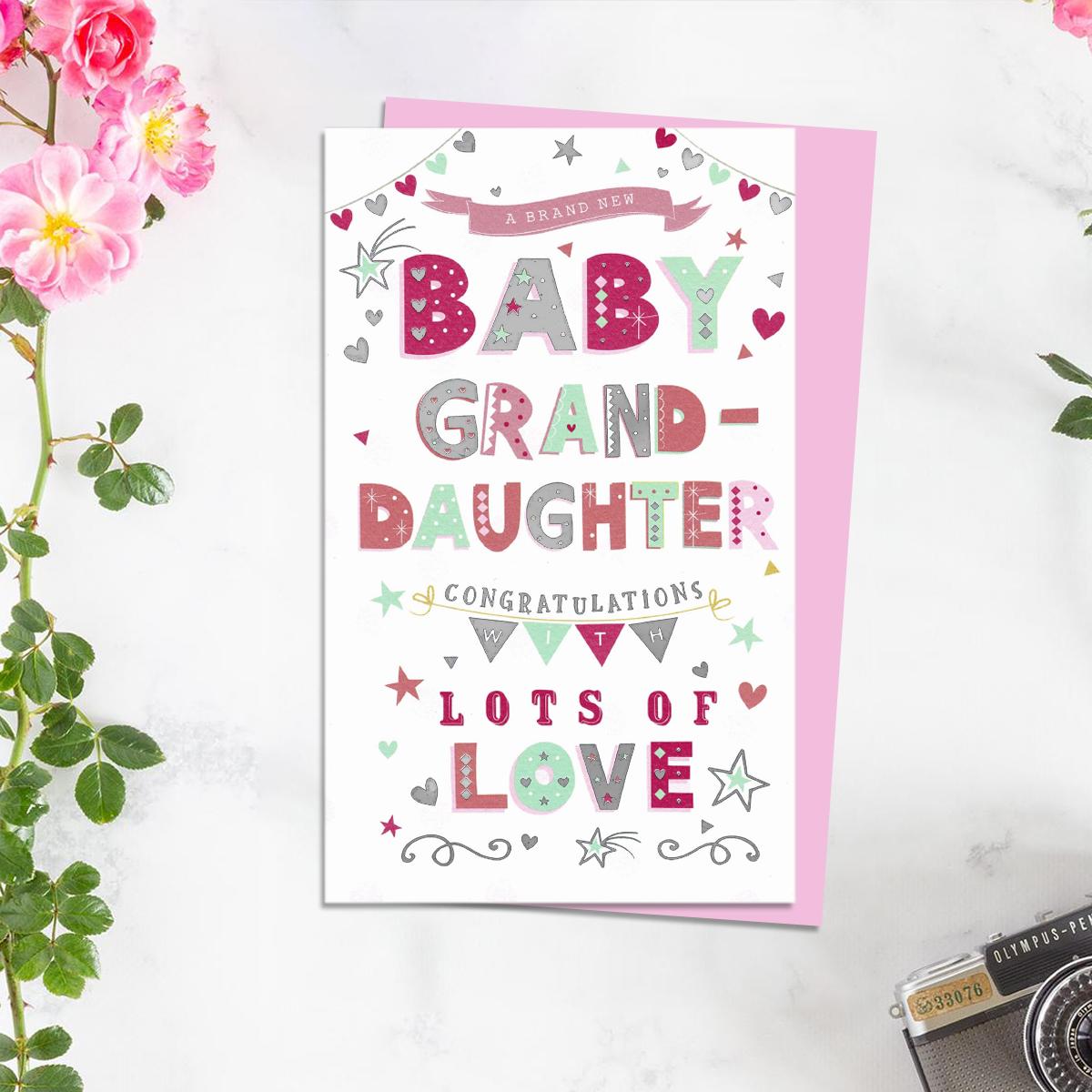 Birth Of Granddaughter Baby Card Alongside Its Light Pink Envelope