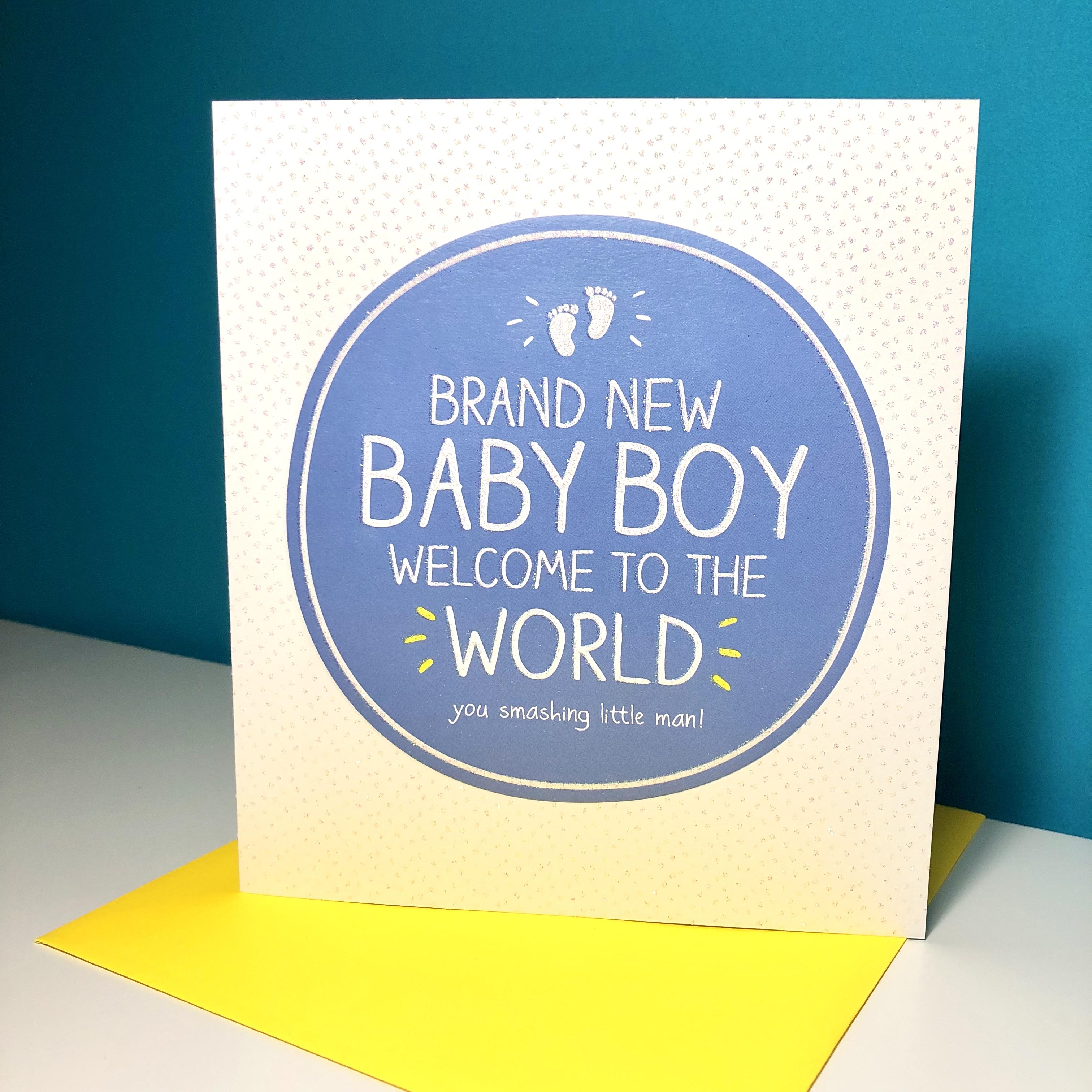 Baby Boy Congrats Card Alongside Its Yellow Envelope