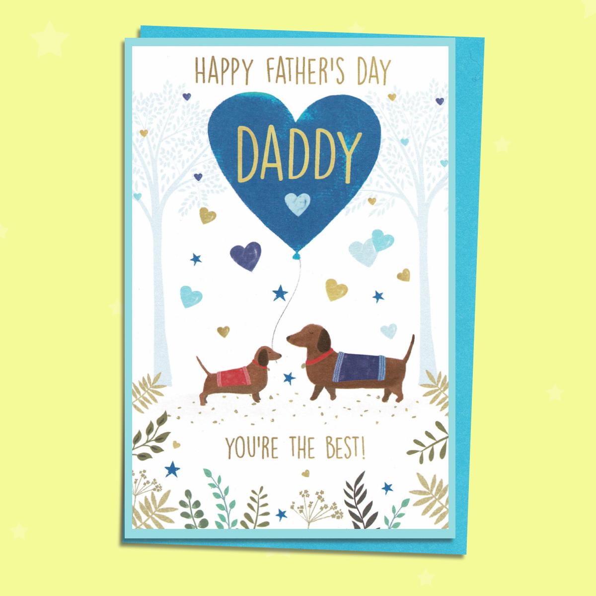 Daddy Sausage Dogs Father's Day Card Alongside Its Light Blue Envelope