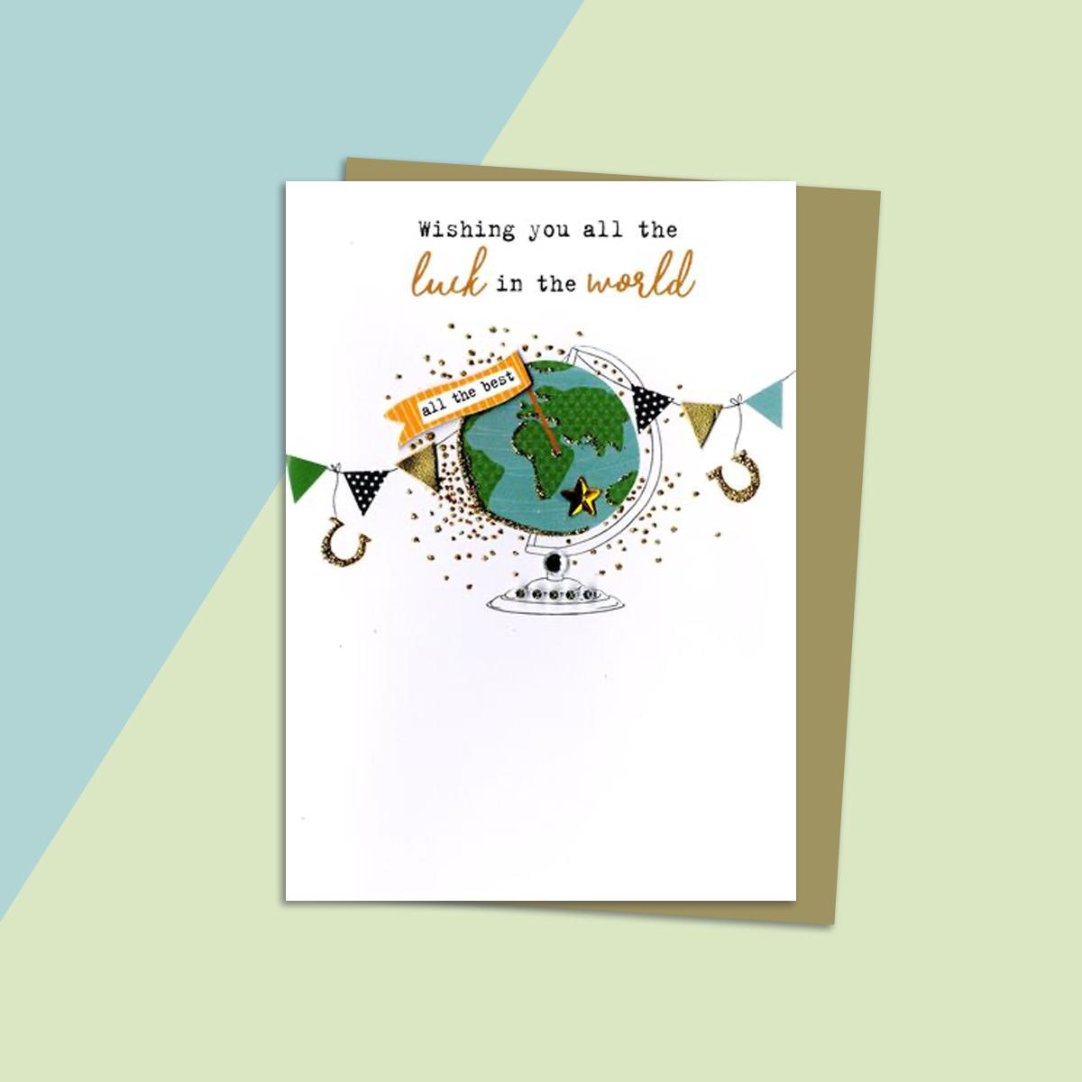 Globe Themed Good Luck Greeting Card Alongside Its Gold Envelope