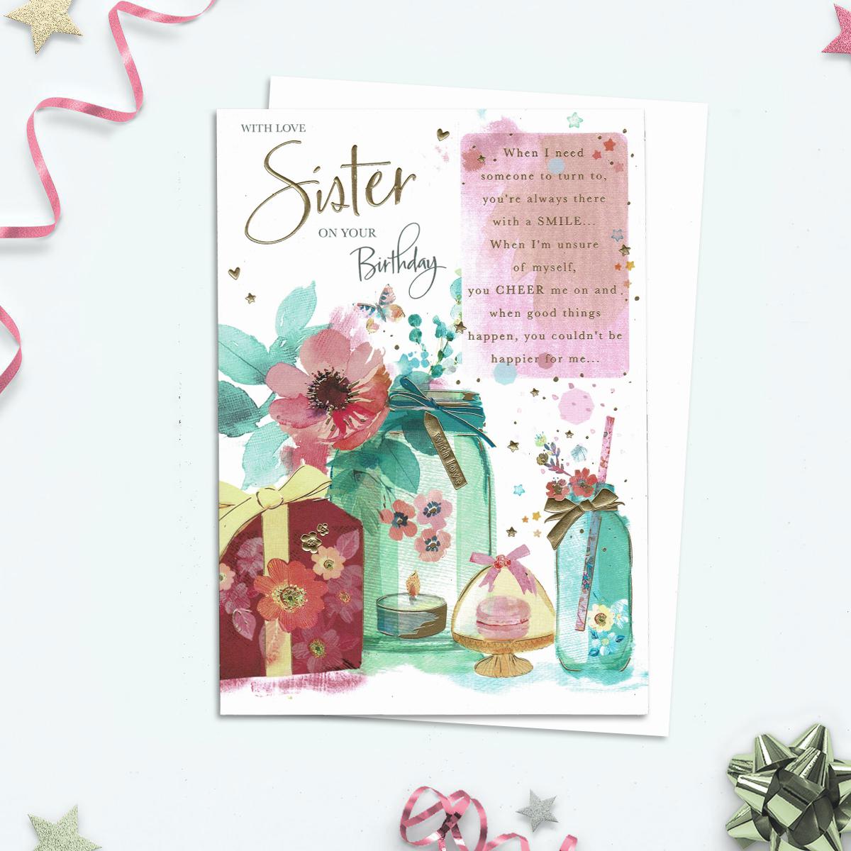 With Love Sister On Your Birthday With Verse Plus Bright Florals And Gifts. These Are Accented In Gold Foil . Complete With White Envelope