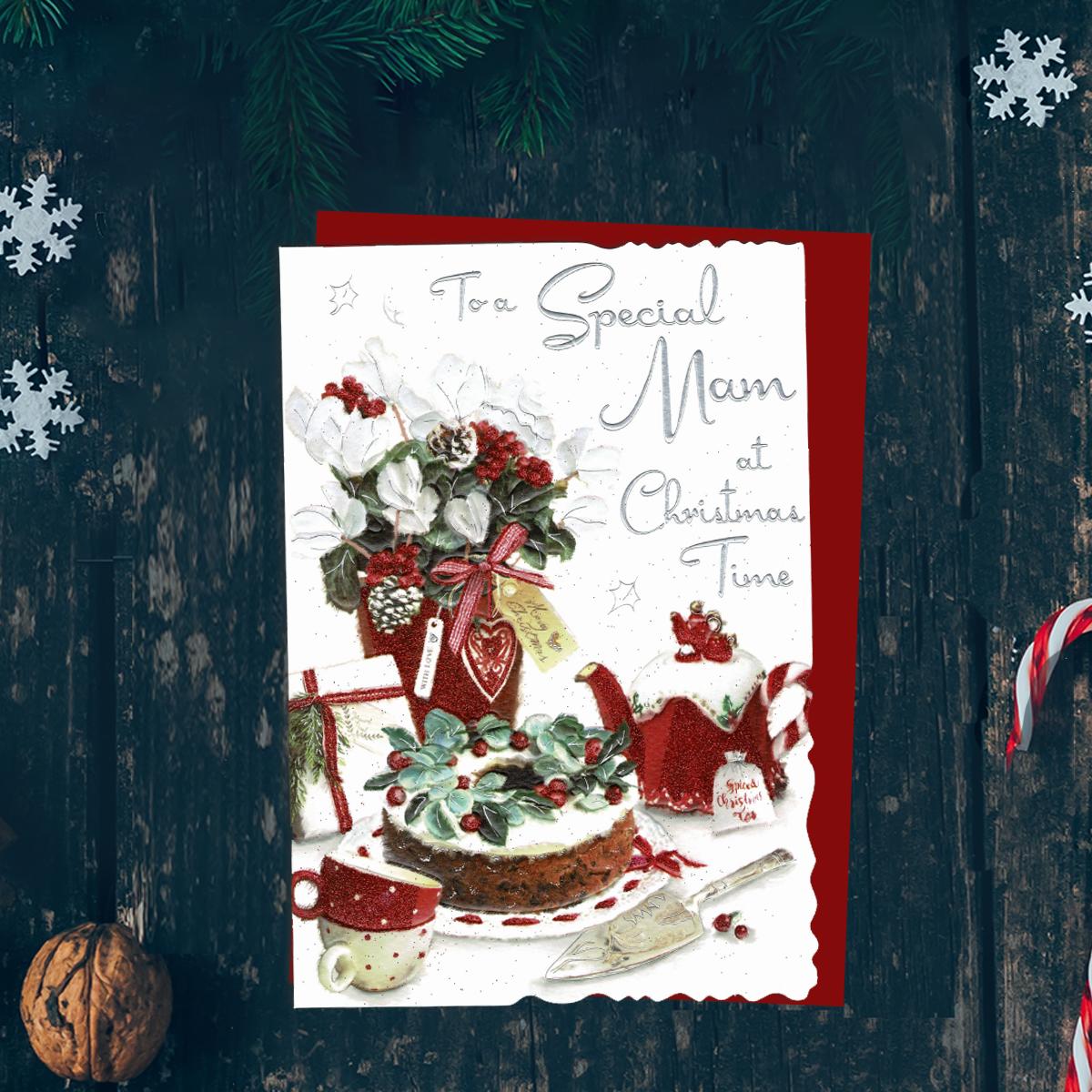 To A Special Mam At Christmas Time Featuring Flowers, Christmas Cake And Tea. Finished With silver Foil Lettering, Red Glitter And Red Envelope