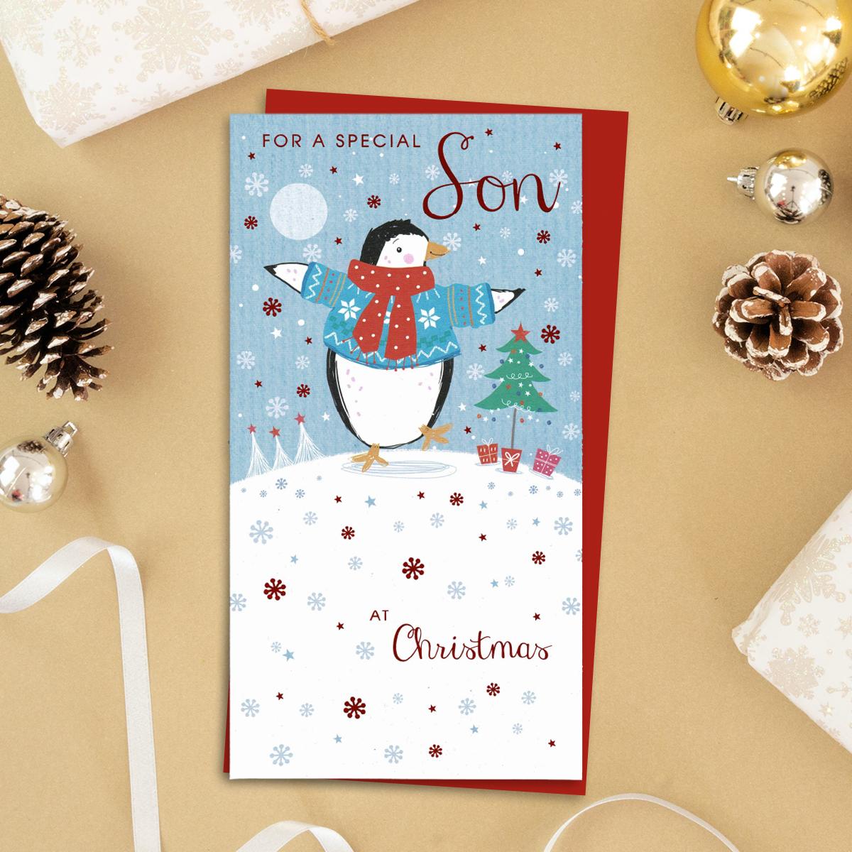 For A Special Son At Christmas Featuring An Ice Skating Penguin! Red Foil Detail And Red Envelope Complete This Design