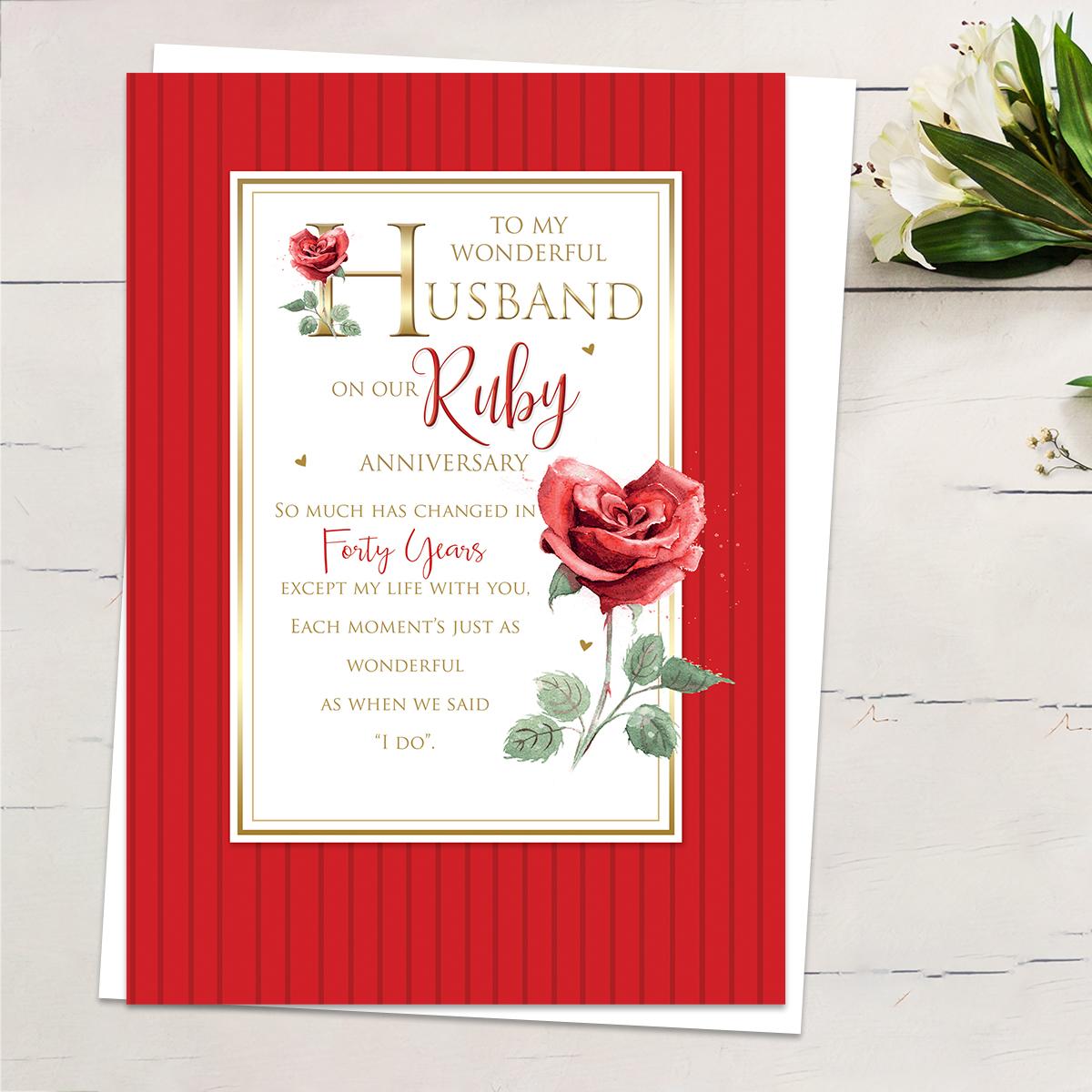 ' To My Wonderful Husband On Our Ruby Anniversary' Featuring Red Stripes With Red Roses And Heartfelt Words Edged In Gold Foiling Detail. Complete With White Envelope