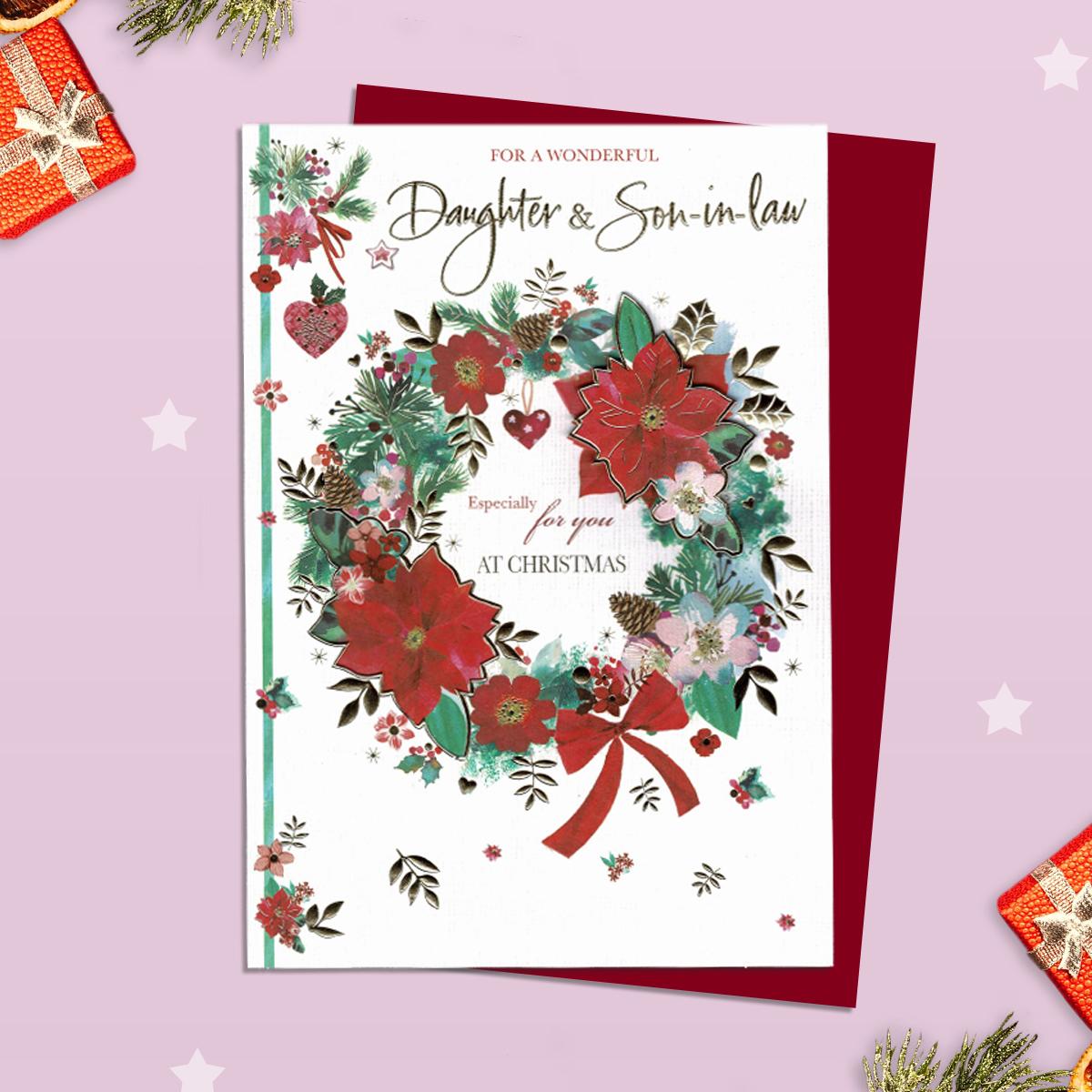 Daughter And Son In Law Decoupage Christmas Card Alongside Its Red Envelope