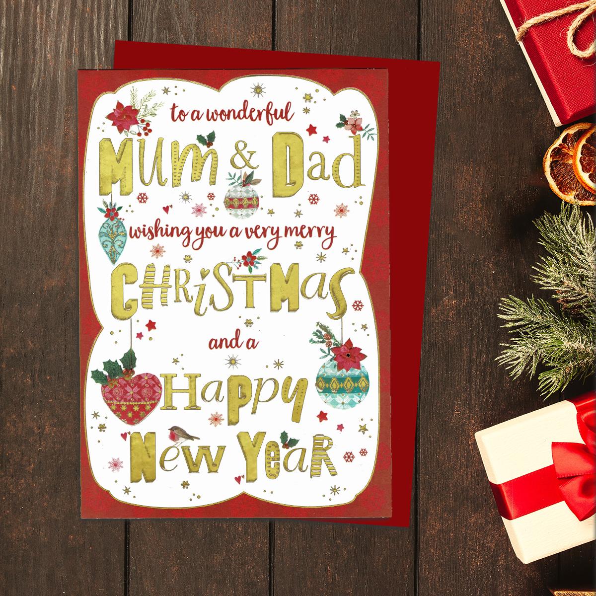 A Red Bordered Christmas Card With -To A Wonderful Mum & Dad Wishing You A Merry Christmas And A Happy New Year- In Gold Foiling On The Front. Complete With Bauble Images And Red Envelope