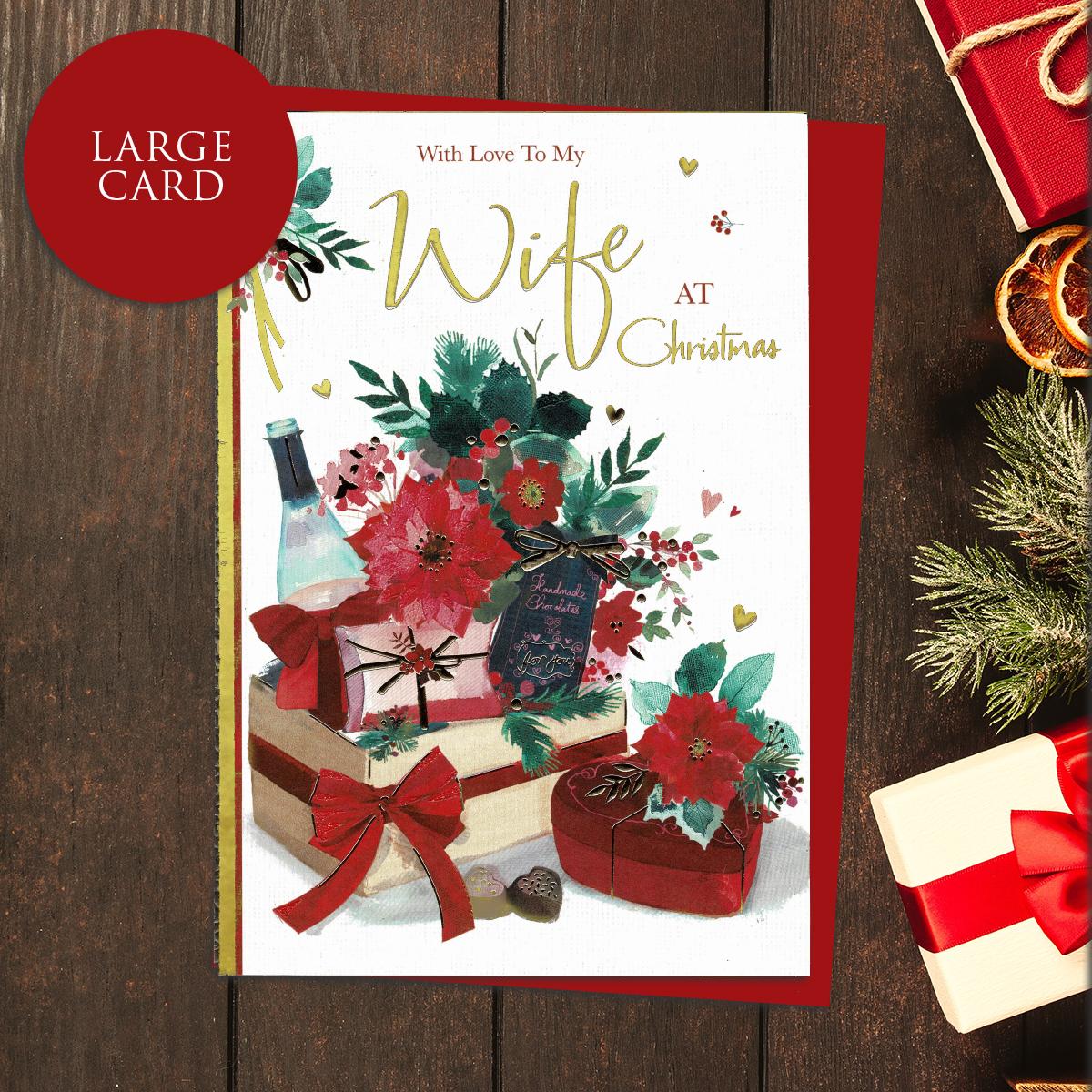 With Love To My Wife At Christmas Card showing A Festive Box Of Gifts And Poinsettias. Accents And Lettering In Gold Foil And Completed With A Co-Ordinating Red Envelope
