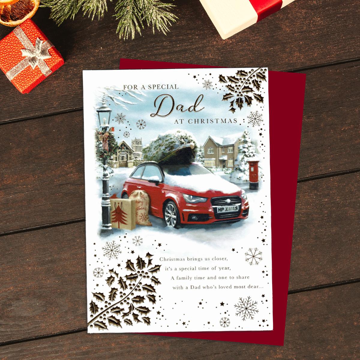 For A Special Dad At Christmas Showing A Red Car On Top Of Which is The Christmas Tree. Finished With Gold Foil Lettering And Complete With A Red Envelope