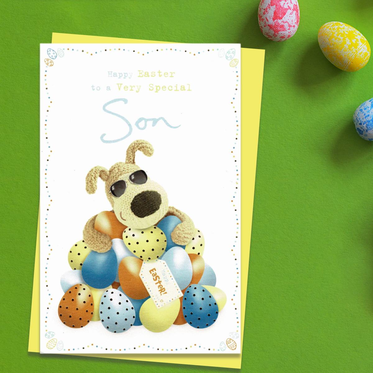 ' Happy Easter To A Very Special Son' Boofle Bear card Featuring Boofle With a Huge Pile Of Easter Eggs! Complete With gold Foil Detail And Yellow Envelope