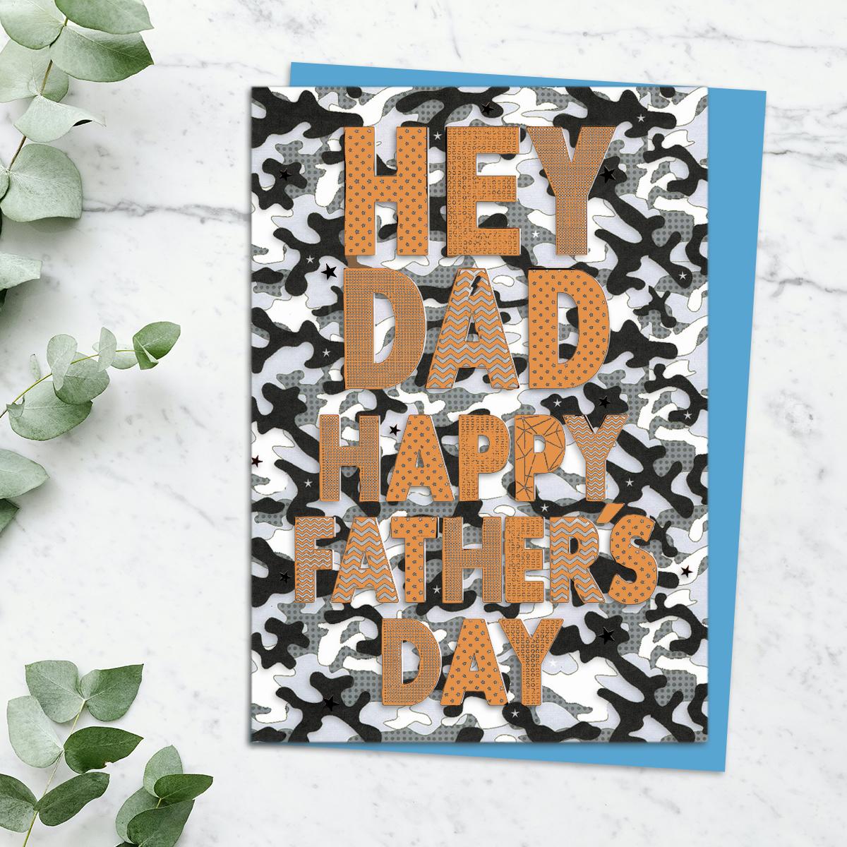 'Hey Dad Happy Father's Day' Card With Black And White Camouflage Background And Copper Foiled Text. Complete With Blue Envelope