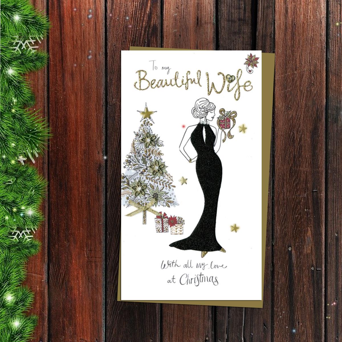 Beautiful Wife Christmas Card Alongside Its Gold Envelope