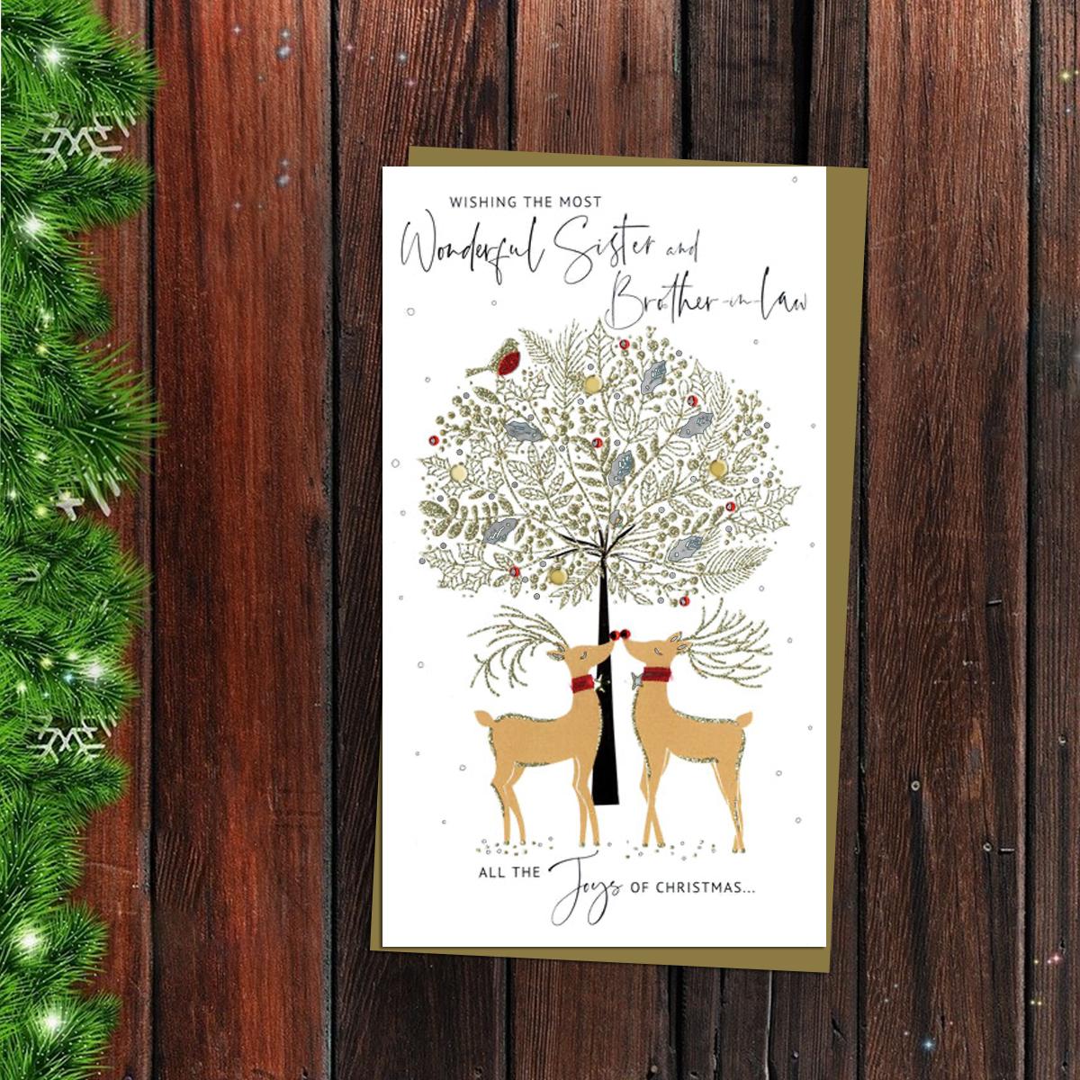 Sister And Brother In Law Reindeers Christmas Card Alongside Its Gold Envelope