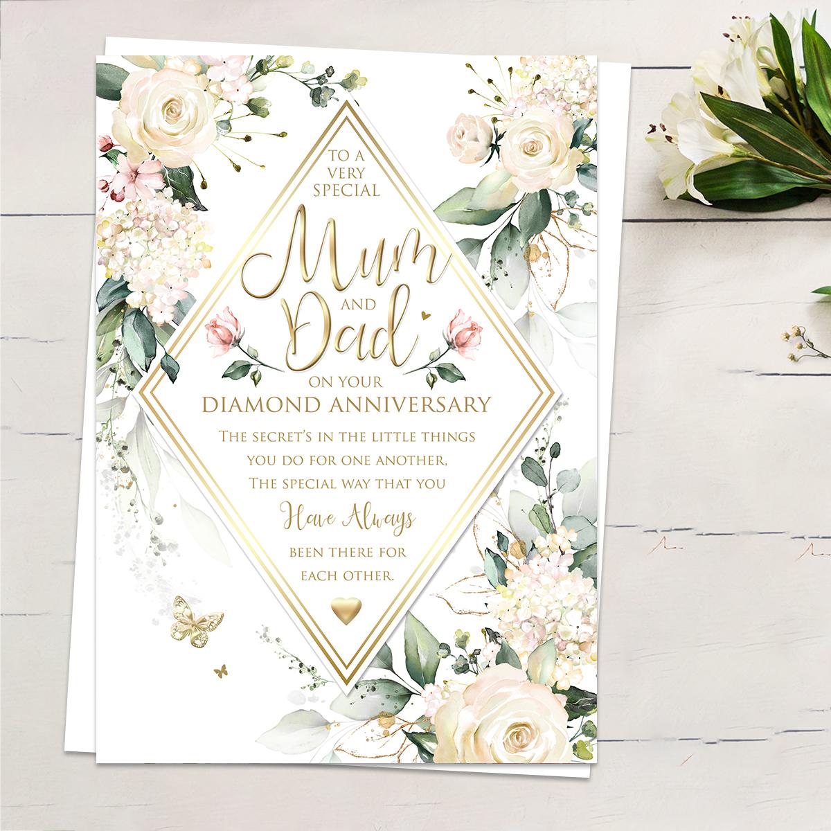 ' To A Very Special Mum And Dad On Your Diamond Anniversary' Featuring Cream And White Flowers And Gold Foiled Butterflies. Complete With White Envelope