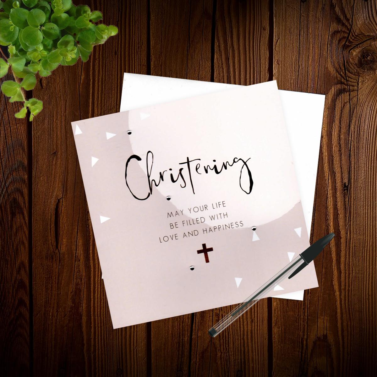 Christening Card Alongside Its White Envelope