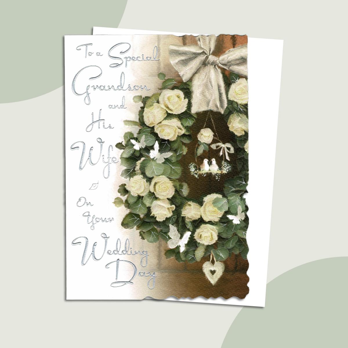 Special Grandson And Wife Wedding Card Alongside Its White Envelope