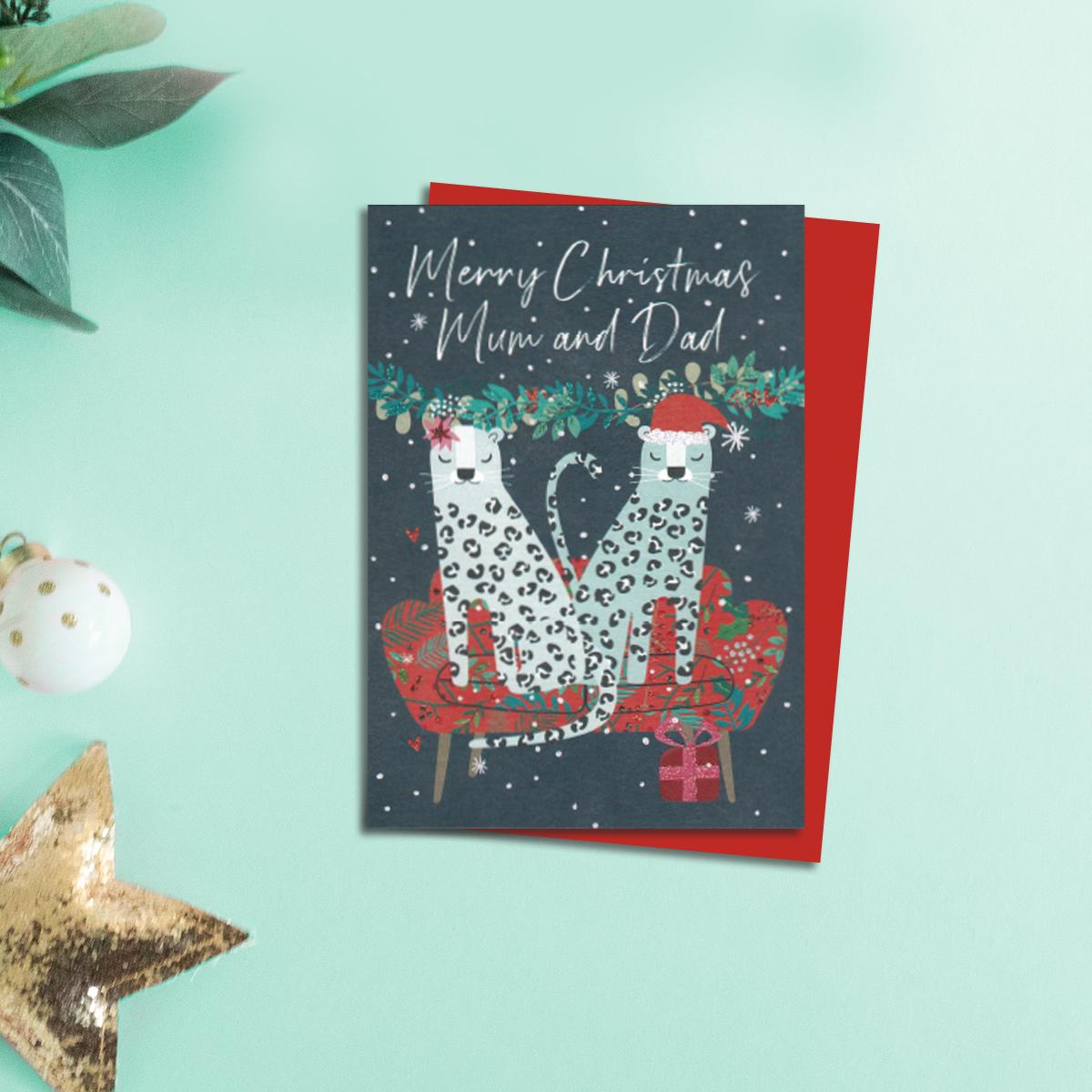 Two Leopard Mum And Dad Christmas Card Alongside Its Red Envelope