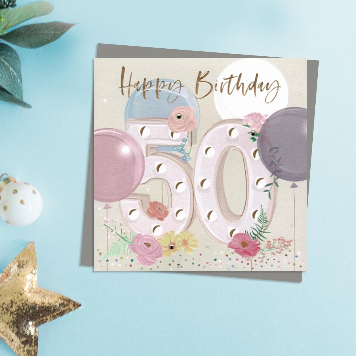 Happy 50th Birthday Card . Pastel Colours And Embellishments Depicting Flowers And Balloons. Complete With Co-Ordinating Grey Envelope