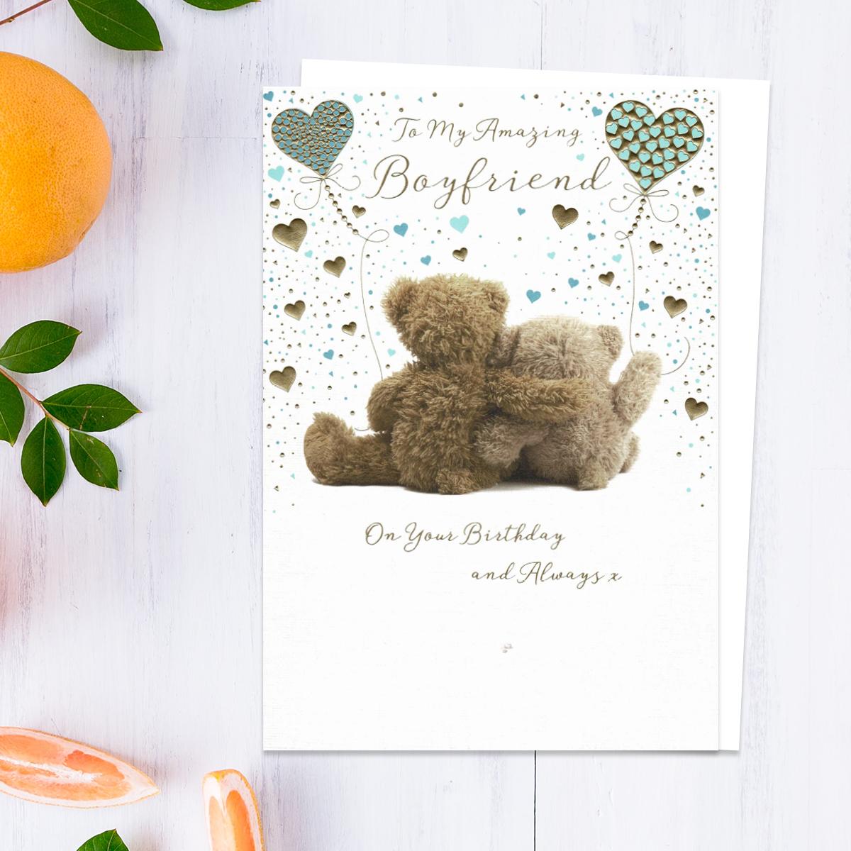 To My Amazing Boyfriend On Your Birthday And Always Showing Two Teddies Holding Balloons. Added Gold Foil Detail And White Envelope