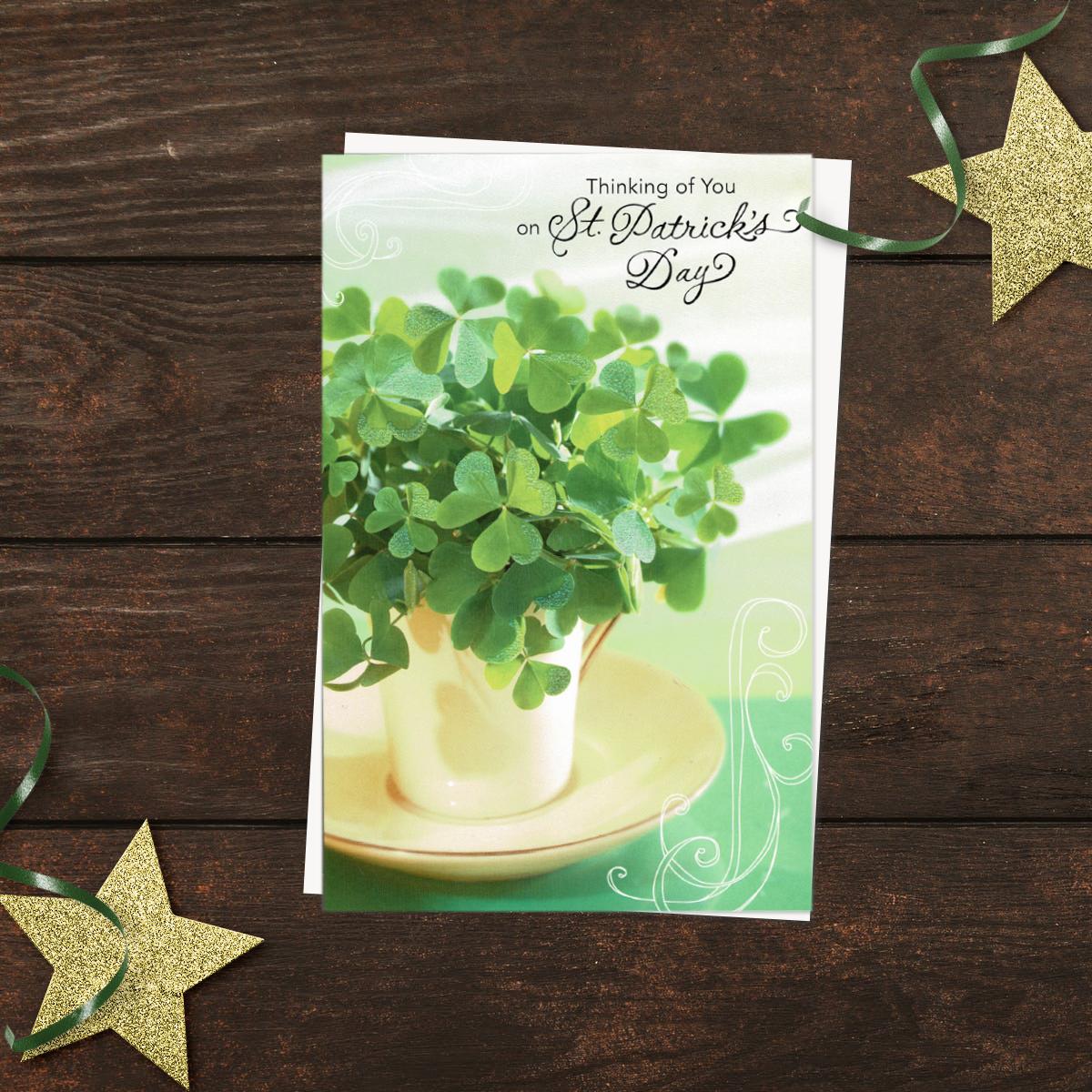 ' Thinking Of You On St. Patrick's Day' Card Featuring A Cup And saucer Filled With clover. With Added Sparkle And White Envelope