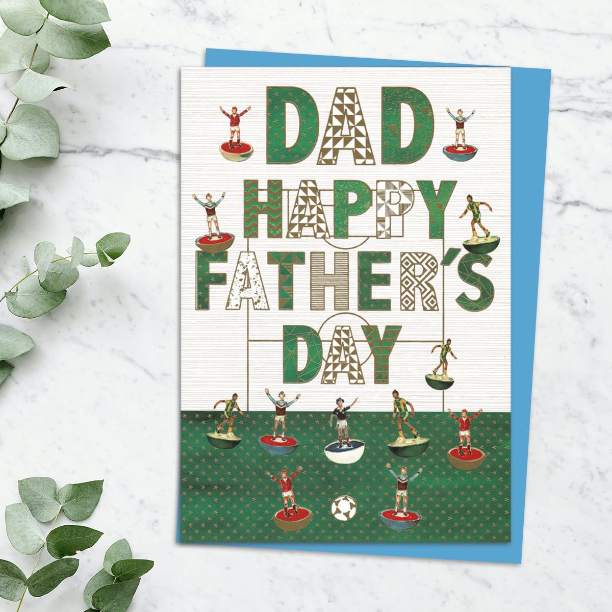 'Dad Happy Father's Day' Card Featuring Subbuteo Football Pieces. With Stunning Gold Foil Detail And Blue Envelope