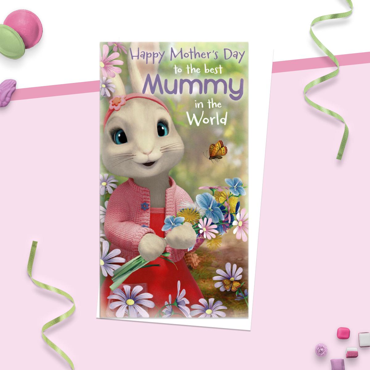 'Mother's Day to the best Mummy in the world ' card showing Peter Rabbit holding a bunch of flowers. Complete With White Evelope
