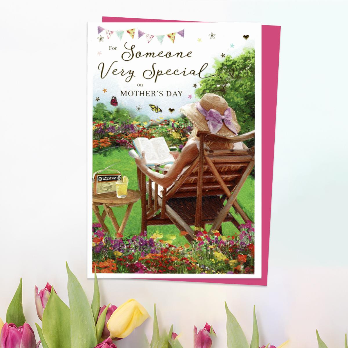 ' For Someone Very Special On Mother's Day' Card Featuring A Lady Sitting In the Garden Reading. With Beautiful Gold Foil Detail And Cerise Envelope