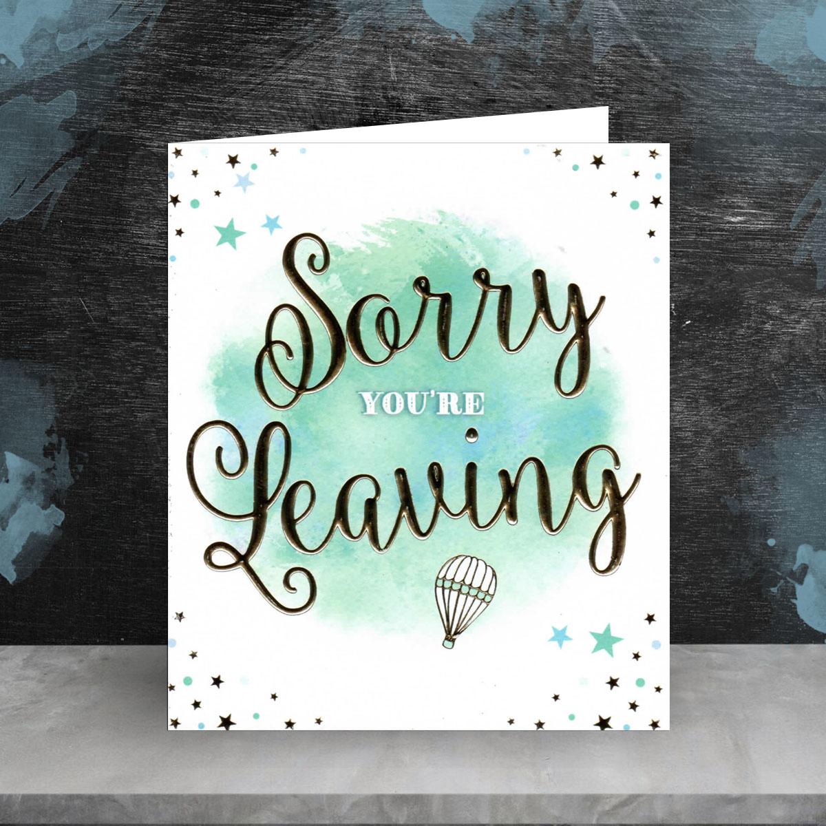 Bright Blue Sorry You're Leaving Card Sitting On The Shelf
