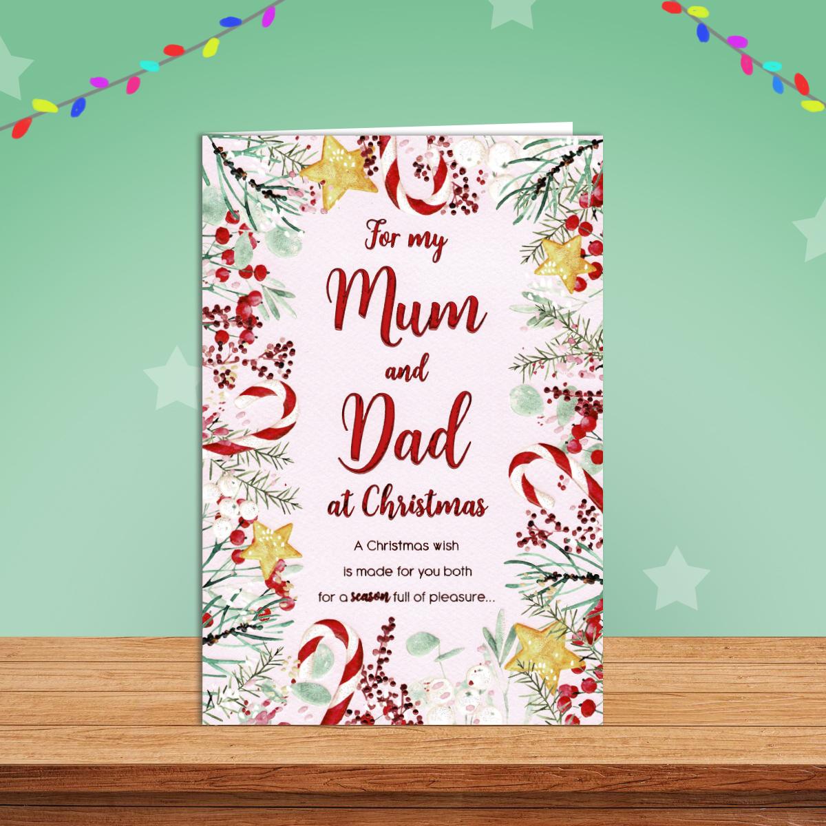Mum And Dad Festive Border Christmas Card Alongside Its Red Envelope