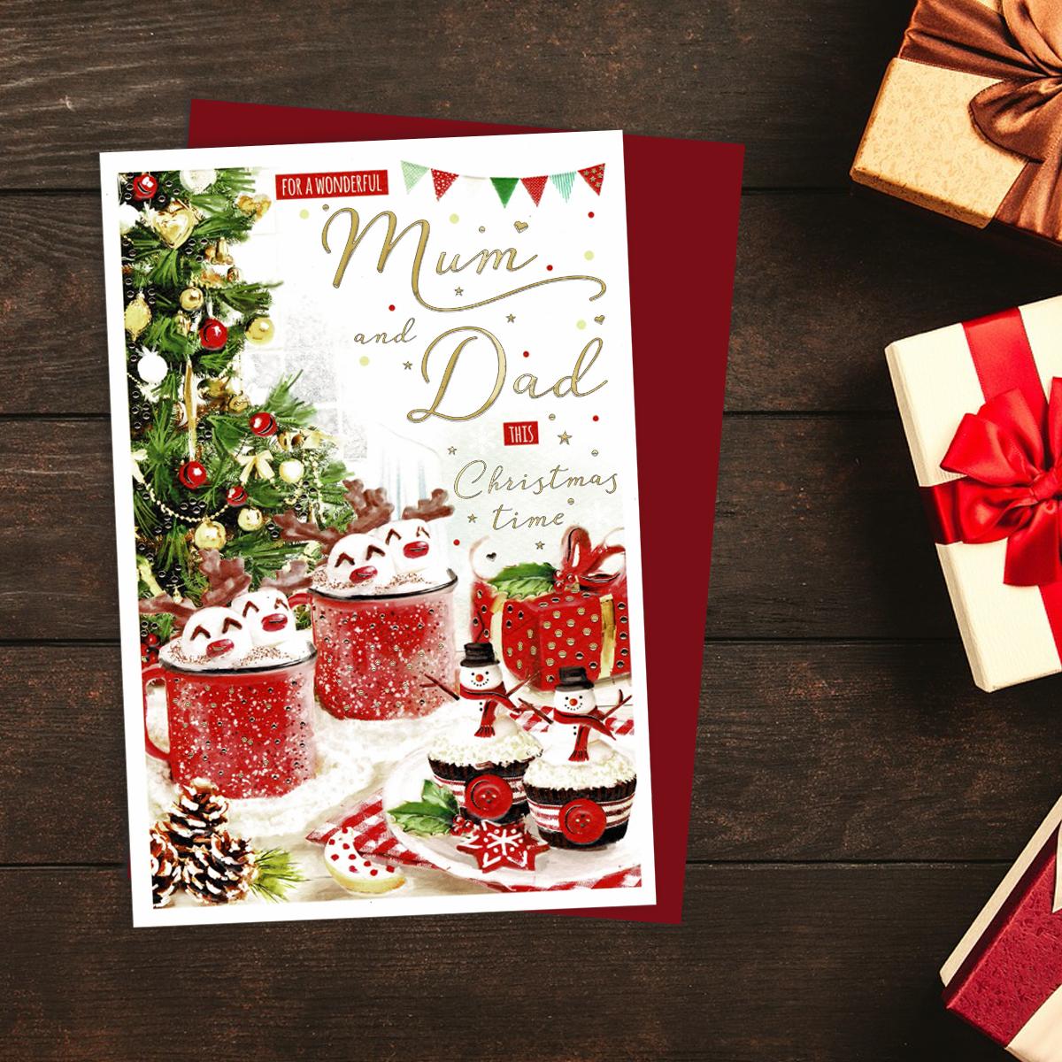 Mum And Dad Christmas Card Alongside Its Red Enevelope