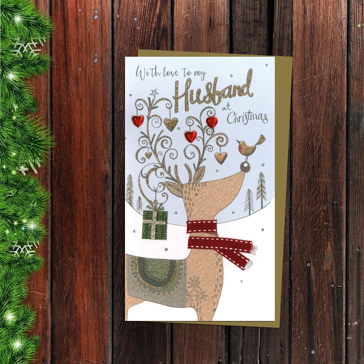 Husband Reindeer Christmas Card Alongside Its Gold Envelope