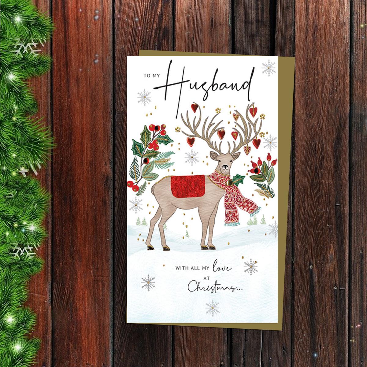 Husband Christmas Card Alongside Its Gold Envelope